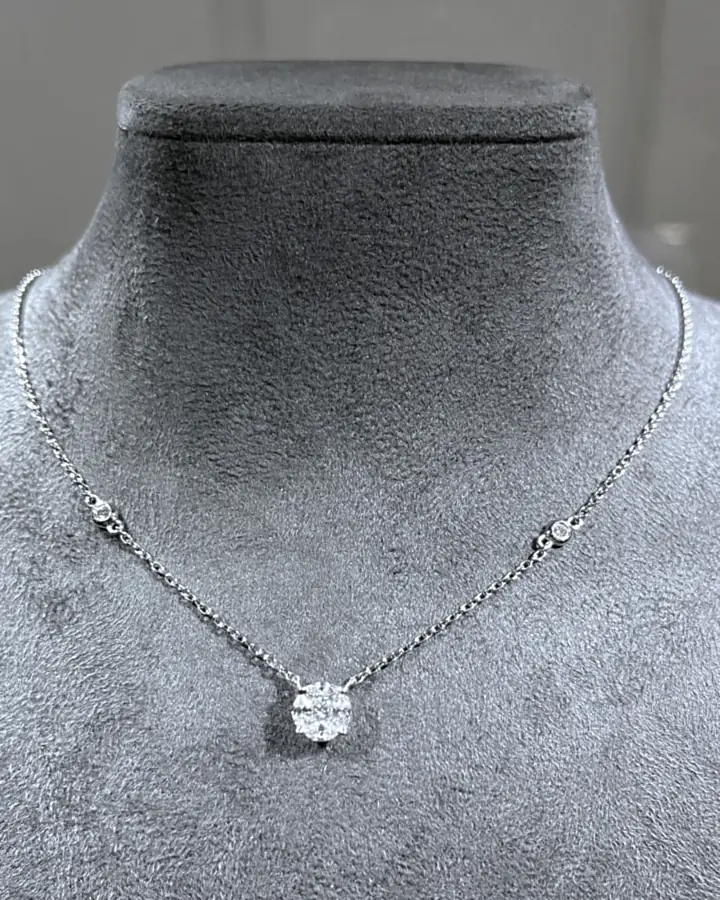 Round brilliant diamond cluster pendant on a fine white-gold chain